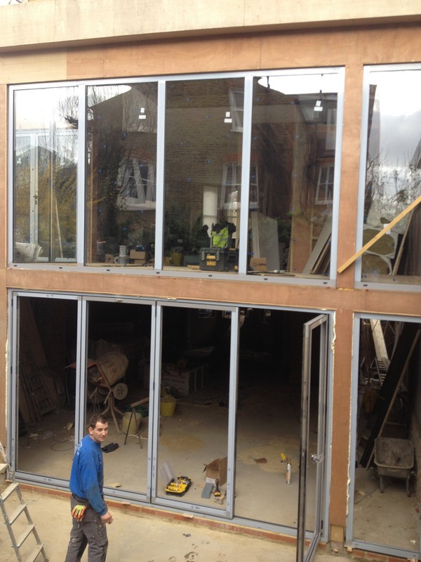 Aluminium bi-fold doors with two-storey glazing in Buckingham