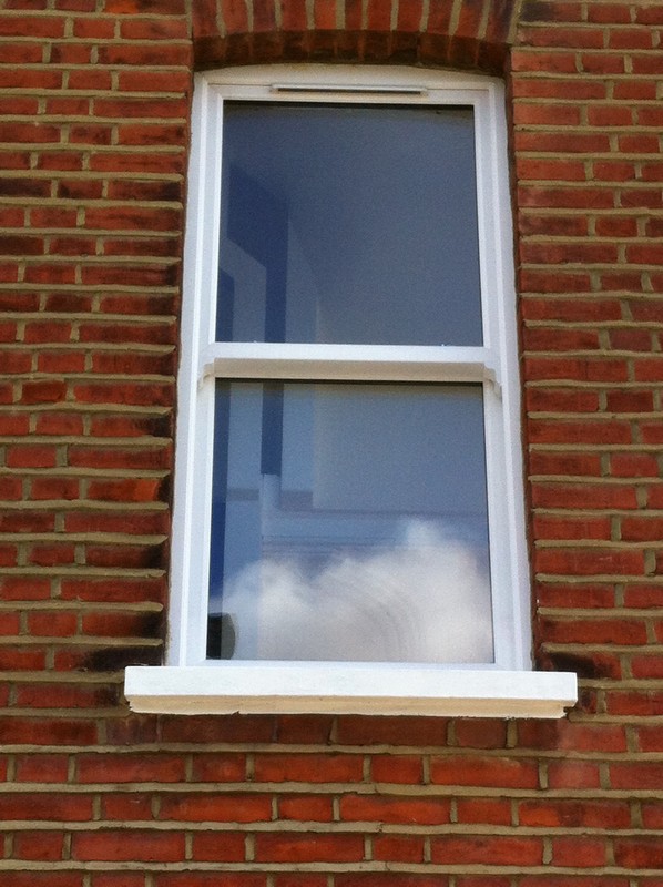 uPVC sash window on Victorian red brick house in Buckingham